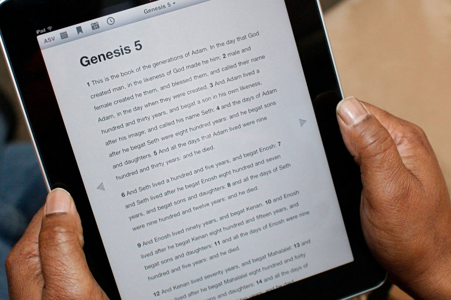 A user reads the Bible on their tablet. 