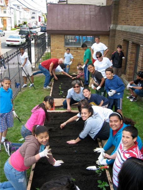 Volunteers work in a community garden. Photo courtesy Connectional Table.