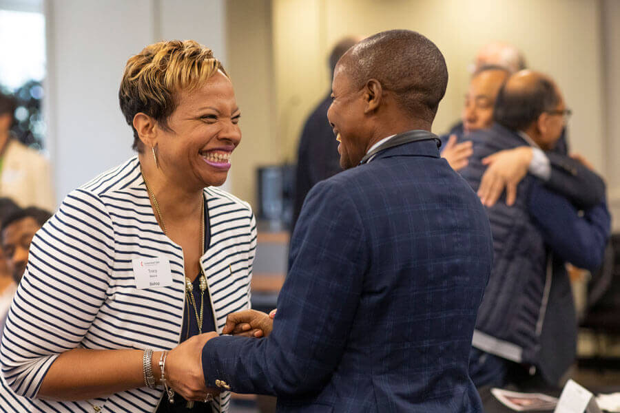Bishop Tracy Malone greets Kitete ka Kempa Prosper during a Connectional Table meeting held at United Methodist Discipleship Ministries in Nashville, Tenn., April 2. Photo by Kathleen Barry, UM News