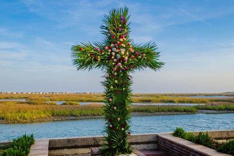 Members of Belin United Methodist Church in Murrells Inlet, South Carolina create a "live" Easter cross in preparation of the Easter sunrise service. Photo by Austin Bond Photography