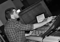 Jordan Romines runs the soundboard during a concert by a worship outreach team from Southwestern College in Winfield, Kan.