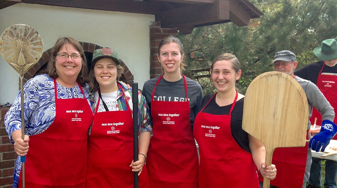 As the Hamline Community Bread Oven pizza bakers, the Rev. Nancy Victorin-Vangerud, left, and Hamline students learn skills of hospitality and baking for their neighborhood. Courtesy photo.