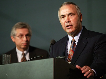 The Rev. William Hinson (right), president of the Confessing Movement, and the Rev. Bruce Robbins, former top staff executive of the United Methodist Commission on Christian Unity and Interreligious Concerns, discuss an anonymously written statement that was circulated at General Conference regarding a possible study on schism. The statement, written as the draft of a resolution, was not presented to the conference and never came up for vote. A UMNS photo by Mike DuBose.