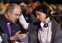 Bishop Marisa de Freitas Ferreira (right) of the Methodist Church of Brazil prays for Bishop Adonias Pereira do Lago, also of Brazil, during evening worship at the 2012 United Methodist General Conference in Tampa, Fla