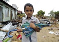 A young tsunami survivor poses in Batticaloa, Sri Lanka. A UMNS photo by Paul Jeffrey, ACT International.