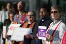 gc2016-shower-of-stoles Protestors in support of LGBTQ clergy line the entryway to the 2016 United Methodist General Conference May 18 in Portland, Ore. Many wore or carried  clergy stoles of defrocked clergy.