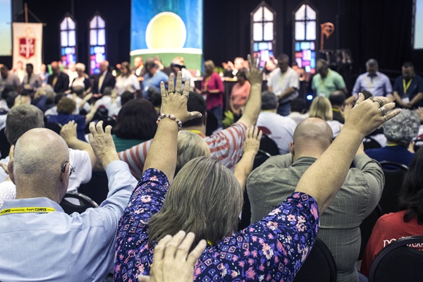 kentucky-annual-conference-2107-umcom-barry 
Attendees of the Kentucky Annual Conference raise their arms in prayer in the morning "Worshipful Work, Plenary." The conference met June 12-14, and members participated in service projects during their annual meeting. Photo by Kathleen Barry, United Methodist Communications.