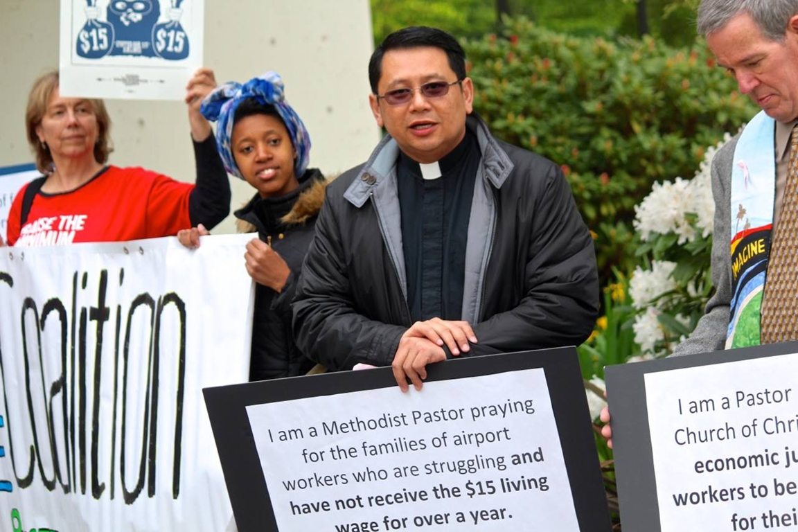 The Rev. Mark Galang (second from right) joins a demonstration advocating a living wage for workers at the Seattle-Tacoma International Airport. Courtesy of Mark Galang 2017.