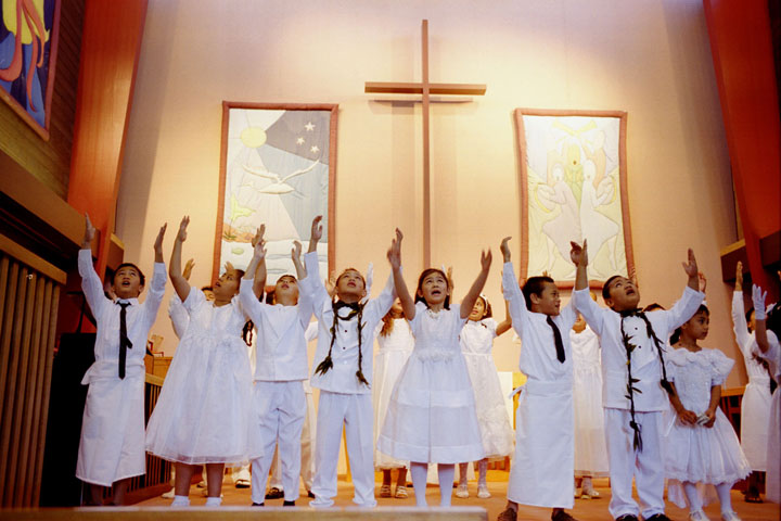 A youth choir from the Samoan Fellowship sings during worship at Turnagain United Methodist Church in Anchorage, Alaska, in this 2000 file photograph.