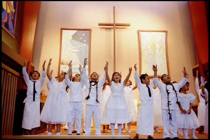 A youth choir from the Samoan Fellowship sings during worship at Turnagain United Methodist Church in Anchorage, Alaska, in this 2000 file photograph.