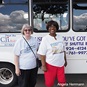 Cecelia Whitfield (r), founder of Use What You’ve Got Prison Ministry, stands with Leah Richmond-Jones beside the ministry’s bus. Image courtesy of United Methodist Women.