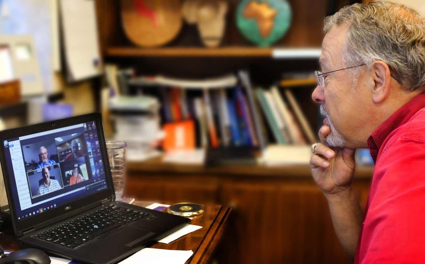 Gil Hanke, top staff executive of United Methodist Men, uses computer technology to connect to one of his weekly covenant discipleship groups modeled after the Wesleyan Class meeting. Photo by Kathleen Barry, United Methodist Communications.
