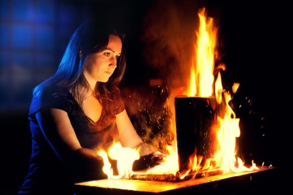Girl with computer on fire