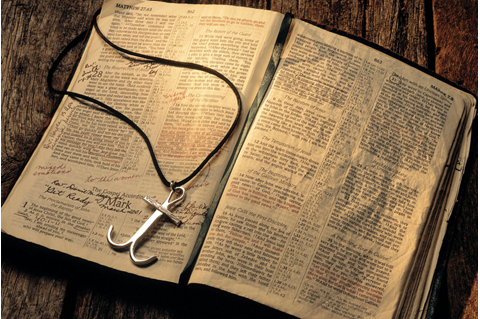 A Holy Bible with an anchor cross. Photo illustration by Mike DuBose, UMNS.