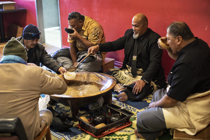 Elders of the church gather in community over the traditional kava kava drink after the Sunday service. Sentiuli Fungalei (goatee) ladles kava for the group.
