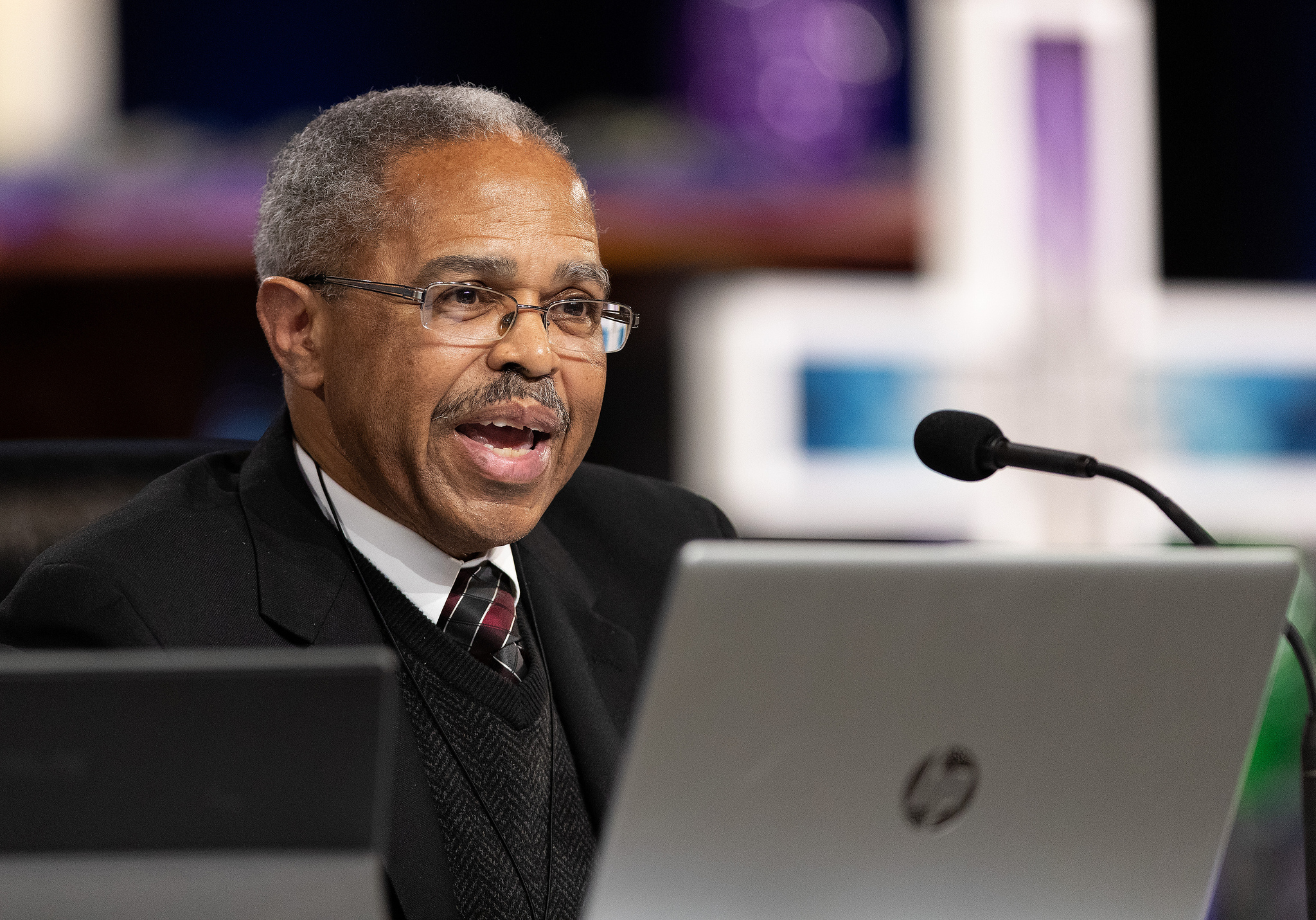 Tennessee Conference delegate Holly Neal (front) raises her arms in praise  during a day of prayer at the 2019 United Methodist General Conference in St. Louis. She is joined by Tennessee delegates the Revs. Stephen Handy (left) and Jacob Armstrong (standing). Photo by Mike DuBose, UMNS. 