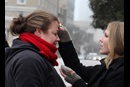 The Rev. Ingrid McIntyre receives ashes from street chaplain, Lindsey Krinks. About 30 people gathered as a community to share in the Ash Wednesday liturgy and to raise awareness of those suffering from homelessness and poverty. A file photo by Kathleen Barry, UMNS.