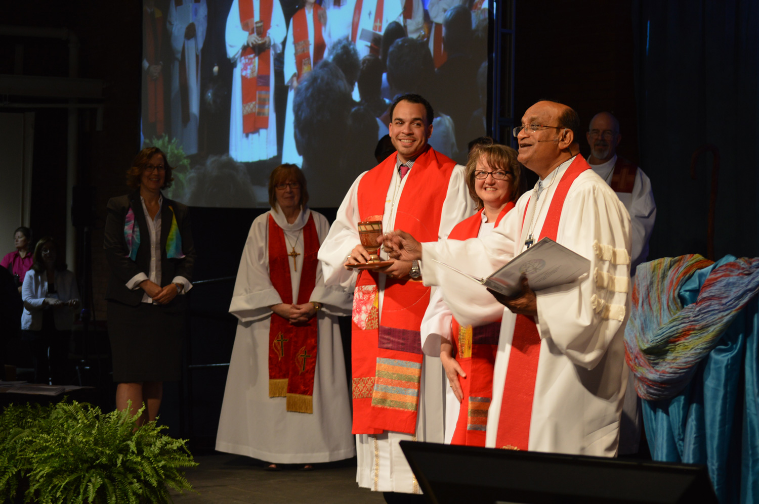 One of the first things many new clergy do after their ordination is help serve communion during the ordination worship service. Photo by Beth DiCocco, New England Conference.