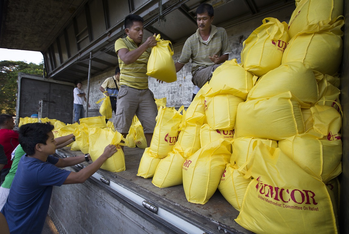 Volunteers load a truck at the offices of the United Methodist Committee on Relief in Manila with relief supplies for survivors of Typhoon Haiyan in the Philippines. Photo by Mike DuBose, UMNS.
