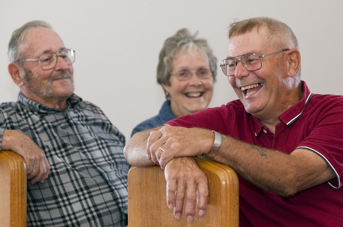 Ben Smith (right) shares a laugh with Roy and Nancy Goodwin at New Hope Bethel United Methodist Church outside Leipsic, Ohio. Photo by Mike DuBose, UMNS.