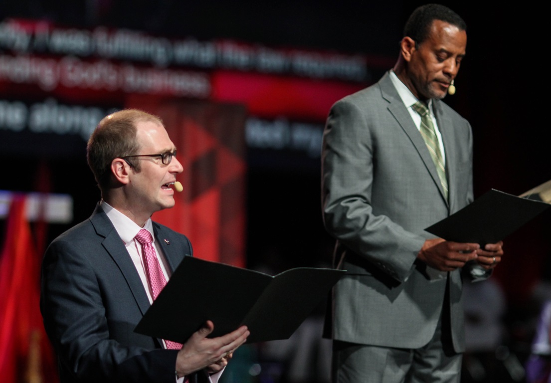 Morning Worship – May 13: An unidentified man (left), a delegate from Central Texas Conference, and Byron Thomas, delegate from North Georgia, participate in the May 13 morning worship of the United Methodist 2016 General Conference in Portland, Ore. Photo by Maile Bradifeld, UMNS.