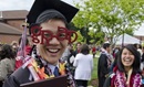 Student celebrates after graduation at the University of Puget Sound in Tacoma, WA. Photo courtesy of Ross Mulhausen, University of Puget Sound.