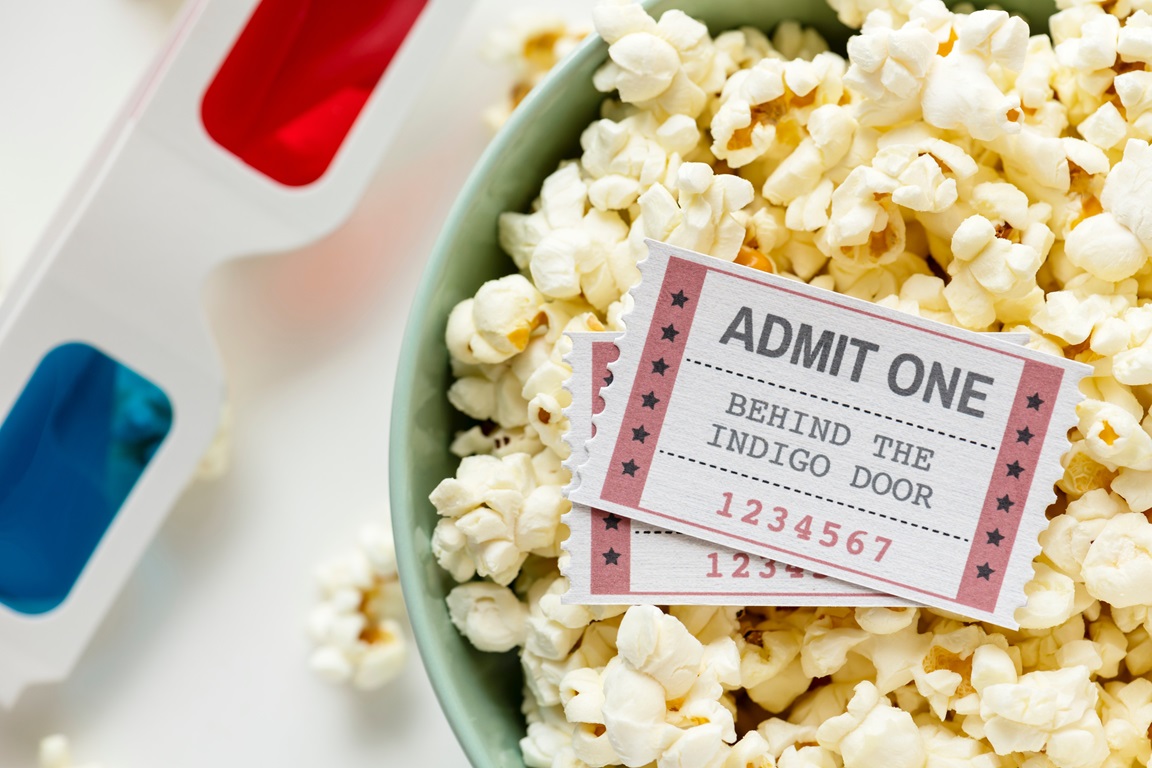 Movie ticket in a bowl of popcorn. Photo courtesy of rawpixel.com from Pexels.