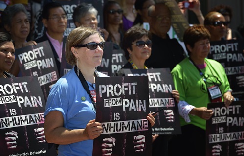 People from from around the world participate in a rally against private prisons during the 2012 United Methodist General Conference in Tampa, Fla. The rally was sponsored by United Methodist Women and the United Methodist Task Force on Immigration. A UMNS photo by Paul Jeffrey.