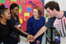 The Rev. Erica Allen in ministry with Project Transformation at Kirpatrick Elementary in Nashville, Tenn. (From left) Chelsi Carr, Briona Jones, the Rev. Erica Allen and Ethan Conner. Photo by Kathleen Barry, United Methodist News.