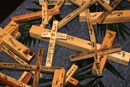 A table filled with small crosses presents participants at Brentwood United Methodist Church to literally "carry the cross" as they meditate on the twelve stations of the cross. Photo by Kathleen Barry, UMNS 3/31/10. 
