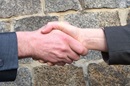 Welcoming handshake. Photo by UliSchu, Pixabay.com.