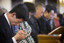 Parishioners pray during worship at Chongwenmen Church Beijing, China in 2013. The United Methodist Board of Global Ministries had named a new China Program associate, Liu Ruhong to work with the denomation's partners in China and the region. Photo by Mike DuBose, UMNS.
