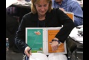 Jean Hawxhurst, delegate from the Kentucky Conference, follows the afternoon session of calendar items and petitions at the 2016 United Methodist General Conference in Portland, Ore. Photo by Kathleen Barry, UMNS.