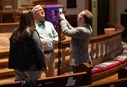 Volunteer Mike Graves (right) sets the camera to livestream a worship service from Belmont United Methodist Church in Nashville, Tenn. Helping prepare are Cindy Caldwell (left) and the Rev. Paul Purdue, Belmont’s senior pastor. Photo by Mike DuBose, UM News.