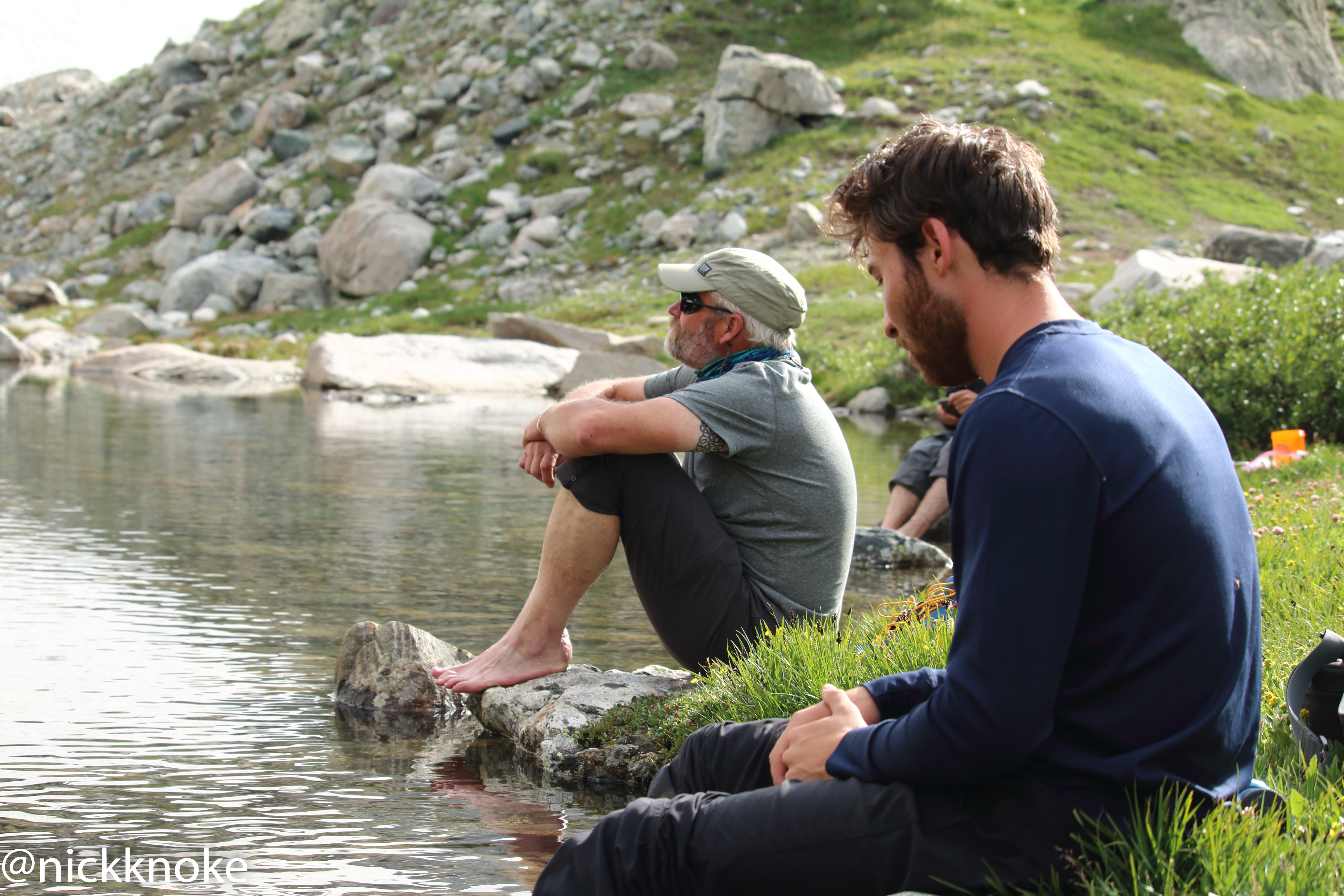 Hikers rest at Elk Lake during a Summit for Soldiers expedition to climb the tallest mountain in WY. Photo by Nick Knoke.