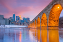 A view of the Minneapolis skyline and the Stone Arch Bridge. (Canva Pro Stock Media/Getty Images Pro)