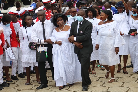 Family and friends of Bishop John K. Yambasu, (from left front) Elizabeth Yambasu, Emmanuel Yambasu, widow Millicent Yambasu and Alfred Lansana, arrive at the burial site on the campus of United Methodist University in Freetown, Sierra Leone. Photo by E Julu Swen, UM News.