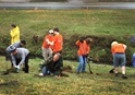 Boy Scouts (orange shirts) are among the 75 volunteers from Hillcrest United Methodist Church, Nashville, Tennessee, and the surrounding community working on a Creation Care project. The group planted 250 native trees on March 14, 2015. Photo by Kathryn Spry