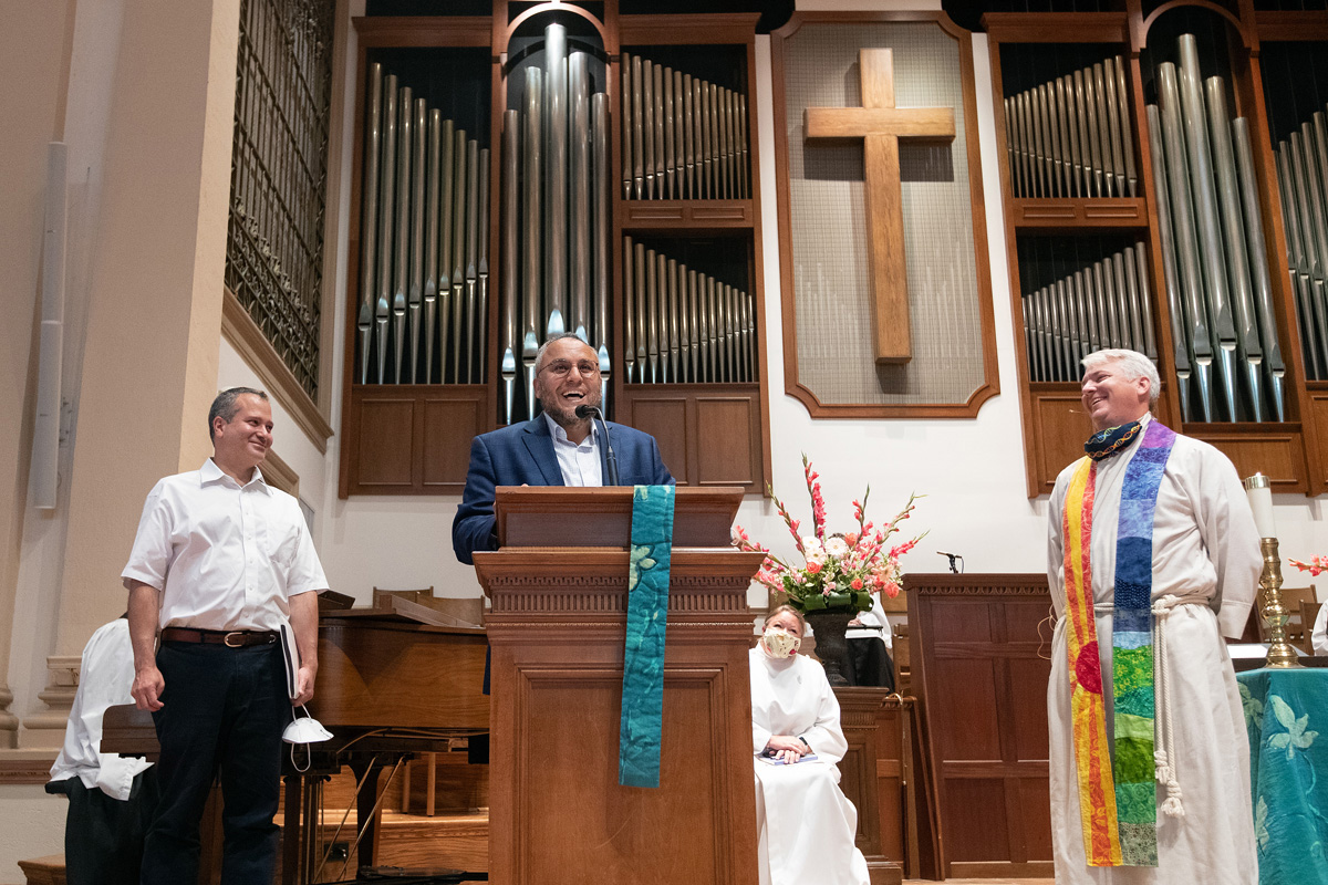 Imam Ossama Bahloul of the Islamic Center of Nashville expresses appreciation to Belmont United Methodist Church in Nashville for hosting his congregation during Friday prayers in the month of Ramadan while their mosque was being renovated. At left is Kamel Daouk, board chairman of the Islamic center. At right is the Rev. Paul Purdue, senior pastor at Belmont. As the U.S. marks the 20th anniversary of the Sept. 11, 2001, terrorist attacks, one expert in Islamic-Christian relations said perceptions of Islam by Americans have improved over the past two decades. Photo by Mike DuBose, UM News. 
