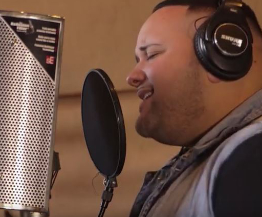 Jeremy Rosado records tracks for a new song dedicated to United Methodists and the fight against malaria. Video image courtesy of United Methodist Communications.