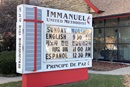 The three churches sharing Immanuel United Methodist Church’s facilities are represented in different languages on the sign in front of the church in Kenosha, Wis. The collaboration is reflected scripturally in the passage from Ecclesiastes 4:12: “A cord of three strands is not quickly broken.” Photo by the Rev. Peter Daekyu Lee.