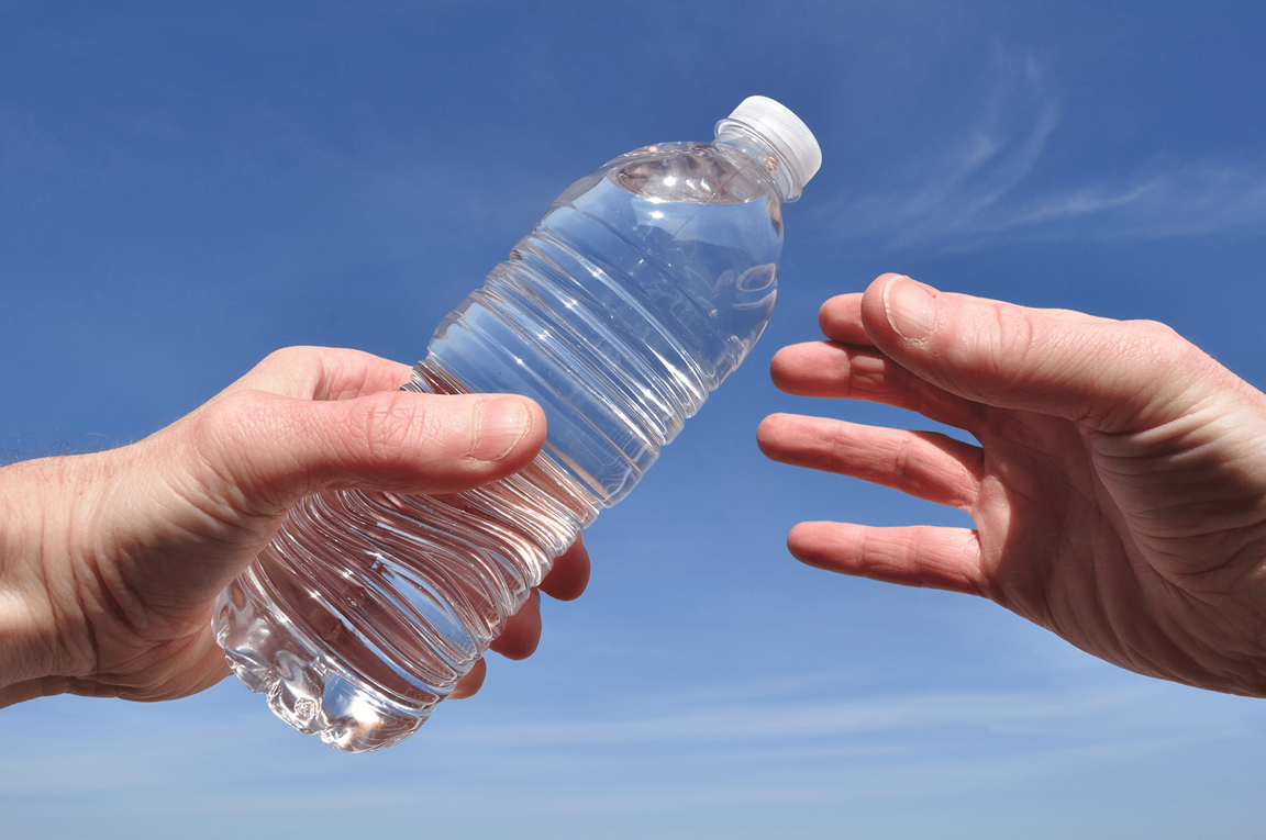 Connecting with your community can be as simple as distributing water at a local event. Image by herreid, iStockPhoto.com.