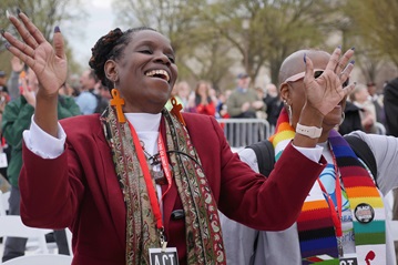 The Rev. Regina Clarke, Mt. Moriah Baptist Church in Washington, raises her hands during the national gathering of faith leaders to end racism. The event was organized by the National Council of Churches on the National Mall. Photo by Kathy L. Gilbert, UMNS.