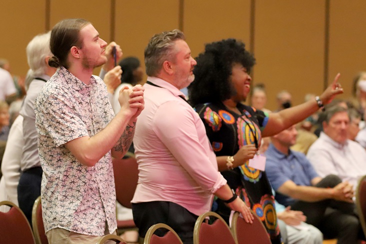 Members of the crowd dance during traditional East African music provided by UMOJA Choir prior to the ordination service at the 2022 annual conference session. Image courtesy of the Great Plains Annual Conference. 