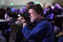 The Rev. Paul Jeffrey, a photojournalist from the General Board of Global Ministries, captures the May 20 closing of the 2016 United Methodist General Conference in Portland, Ore. Photo by Kathleen Barry, UMNS.