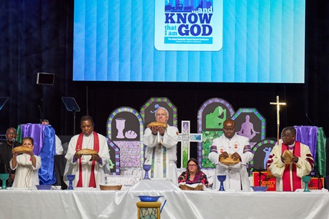 During the opening worship service of the United Methodist General Conference in Charlotte, North Carolina, on April 23, 2024, five United Methodist bishops from around the world celebrate communion with participants. Photo by Paul Jeffrey, UM News.