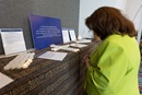 Norma Villagrana of the Western North Carolina Conference prays at an altar in the General Conference prayer room in Charlotte, N.C. The “Cultivating the Garden of the Heart” prayer room is sponsored by The Upper Room and includes prompts and Scriptures in Portuguese, Korean, French and Kiswahili. Photo by Mike DuBose, UM News.