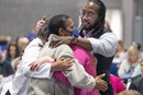The Rev. Jay Williams (right) hugs fellow delegates after the United Methodist General Conference, meeting in Charlotte, N.C., voted May 1 to remove The United Methodist Church’s longtime ban on the ordination of clergy who are “self-avowed practicing homosexuals.” Photo by Mike DuBose, UM News.
