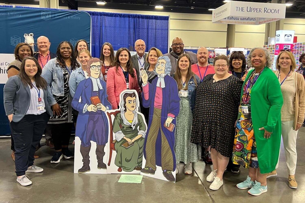 The GCAH General Conference booth was a popular spot for hundreds of attendees, including the entire Arkansas GC delegation, who stopped by for selfies with Methodism's founders. Photo by Crystal Caviness, United Methodist Communications.