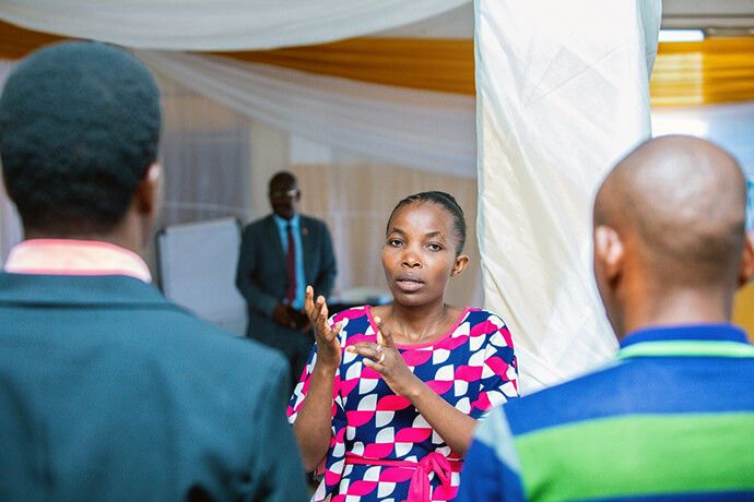 Sign-language interpreter Micheline Nkundwanabake explains signs to participants at a training session for local United Methodist clergy and laity in Burundi. The training is part of a new initiative The United Methodist Church in Burundi launched with support from the United Methodist Deaf and Hard of Hearing Ministries and United Methodist Board of Global Ministries. Photo by Rev. Niyiragira Ladislas, UM News.